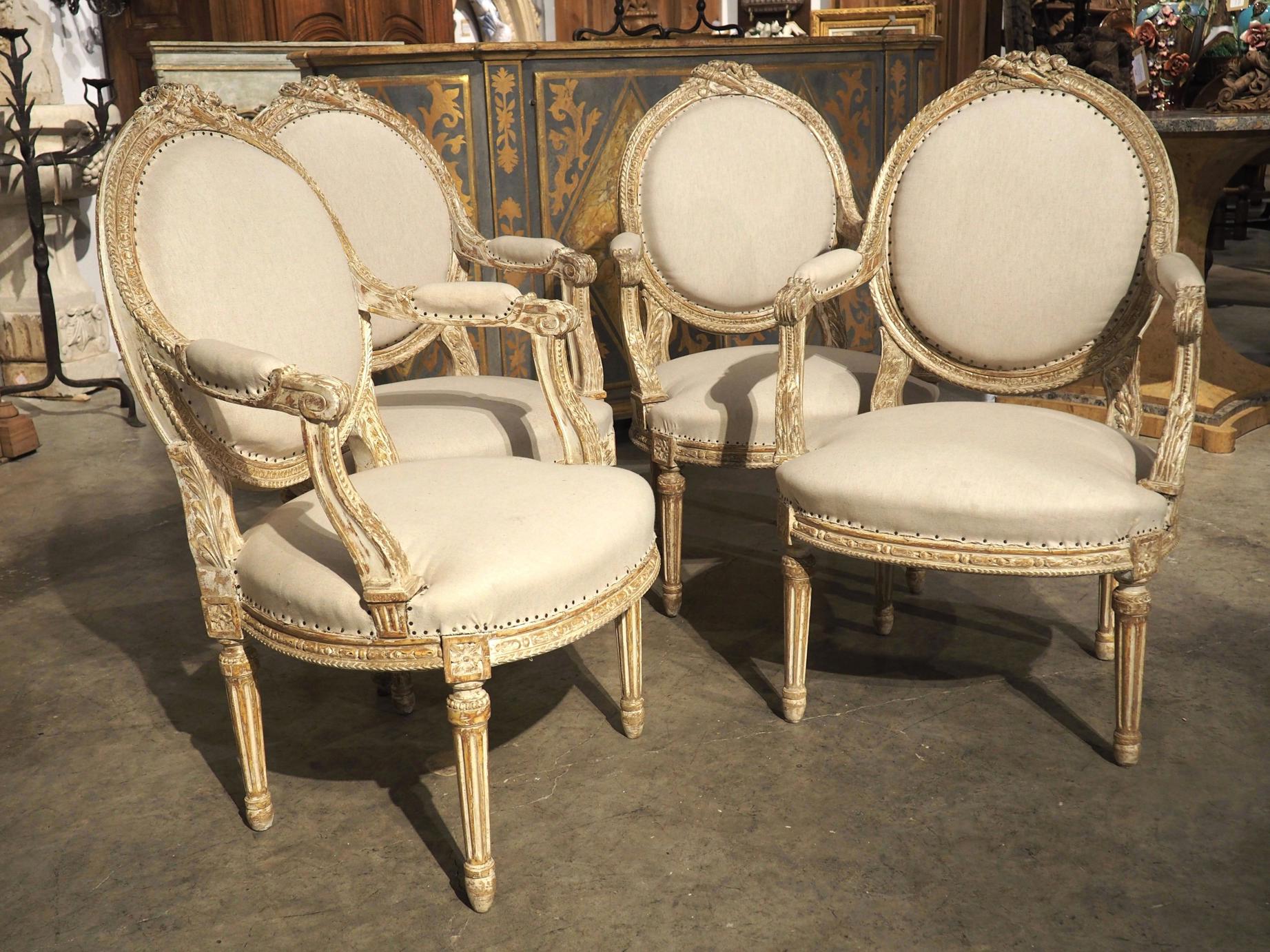 Set of antique French Louis XIII style dining chairs in oak, circa 1890.