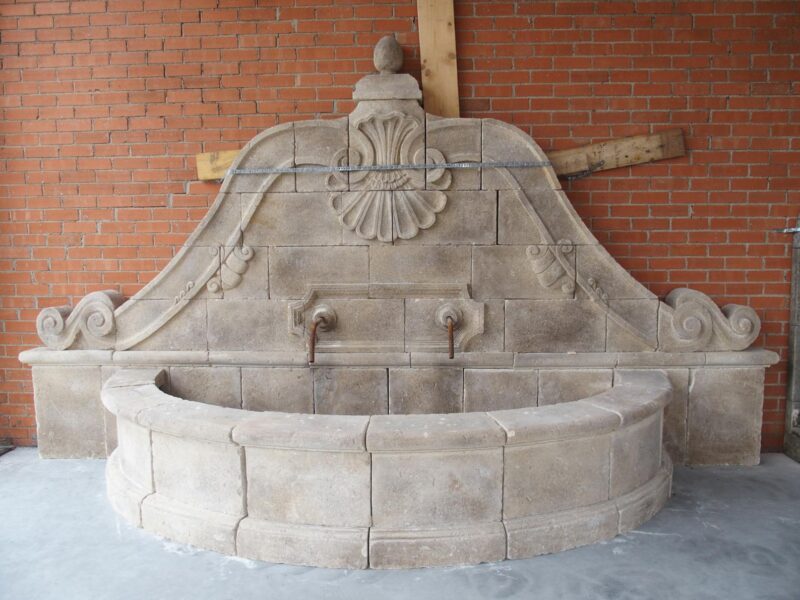 A Grand Carved Limestone 2-Spout Italian Villa Wall Fountain with Arched Basin