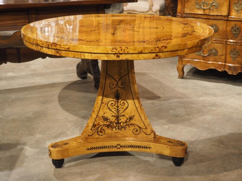 A 20th Century French Charles X Style Center Table with Marquetry Decor